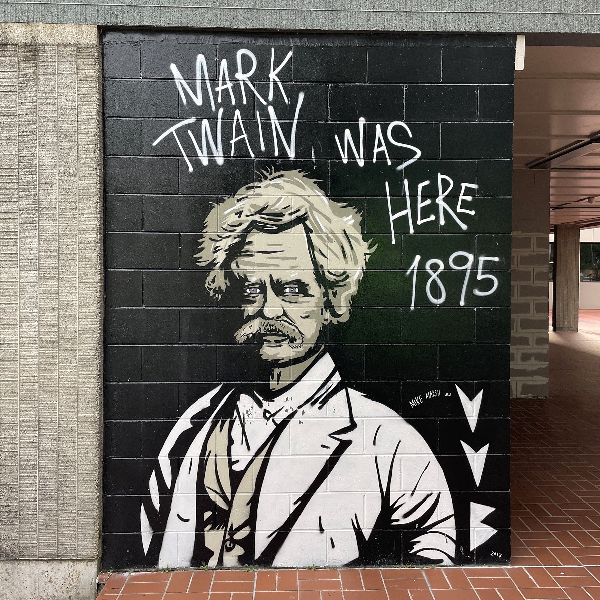 Street art painting of Mark Twain on the outside of the Civic Administration Building